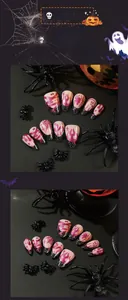 Detail of Halloween press-on nails featuring purple flames, spider webs and glitter stars