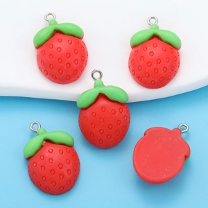 Macro shot of 5 resin strawberry charms with realistic texture and metal hanging loops