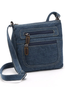 Retro dark blue denim crossbody bag with multi-pocket structure and brown leather zippers