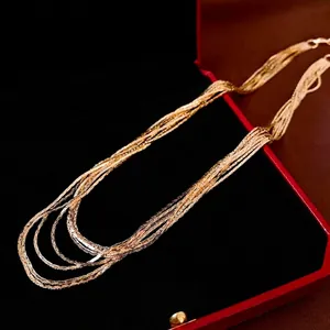 Luxurious multilayered gold-plated chain necklace presented in a classic red jewelry box