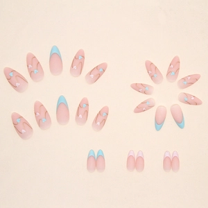 Matte almond press-on nails with blue and pink heart designs and French tips