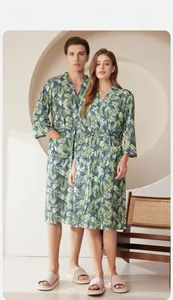 Detail of tropical palm leaf print bathrobe with adjustable waist belt and kimono collar