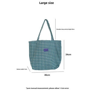 Detailed view of large checkered woven tote bag with 46cm width and 34cm height dimensions