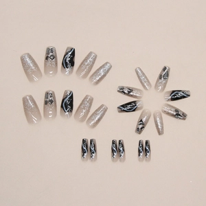 Mid-length ballet fake nails with black glitter, silver shimmer, and geometric rhinestones