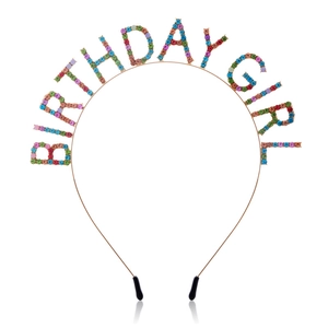 Detail of BIRTHDAY GIRL headband featuring multi-colored rhinestones and gold metal frame