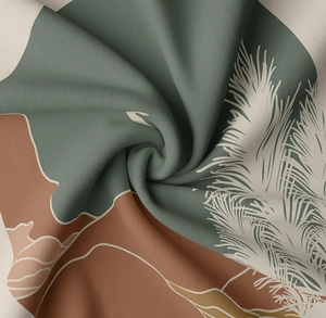 Detail of bohemian tapestry fabric showing white palm leaf print on dark green textile