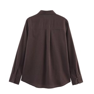 Detailed back view of dark brown linen shirt featuring back pleat and premium fabric texture