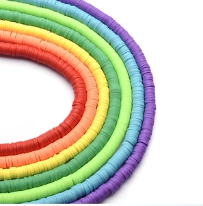 Close-up of rainbow polymer clay disc beads for DIY jewelry making and bracelets