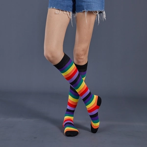 Detailed close-up of rainbow striped cotton socks with black toe and heel contrast