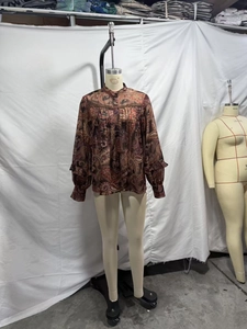 Detail view of Bohemian paisley chiffon blouse with pleated collar and ruffled cuffs