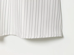 Close-up of black striped fabric with precise stitching and high-quality woven texture