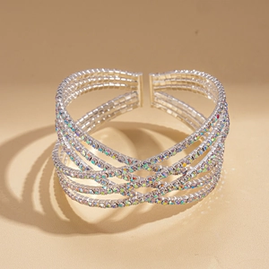 Detail of silver triple-layered cross cuff bracelet with iridescent rhinestones