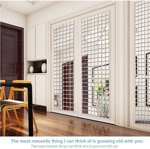 Self-adhesive square mirror mosaic wall stickers applied on a white interior door panel