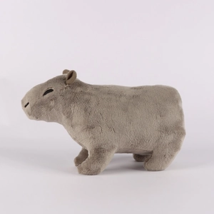 Side view of a soft brown capybara plush toy made from premium short plush material