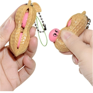 Peanut fidget toy keychain showing squeeze action with popping pink bean and metal chain