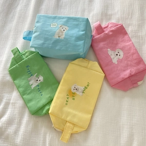 Set of four colorful dog print canvas makeup bags with convenient handles for travel