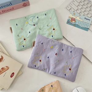 Detailed close-up of quilted star embroidery fabric on travel passport organizers