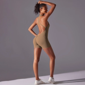 Close-up of cross-back straps and open back detail on khaki athletic yoga jumpsuit
