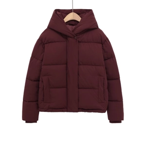 Women's padded hooded winter jacket in burgundy featuring quilted design and side pockets