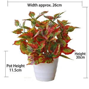 Artificial green leaf plant in white pot measuring 30cm height and 26cm width
