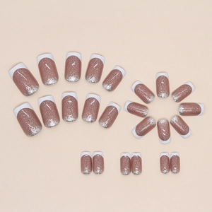 French tip press-on nails set in mauve with silver glitter gradient on beige background