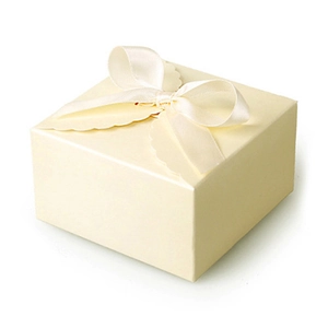 Elegant beige square paper gift box with decorative cream ribbon bow for soaps