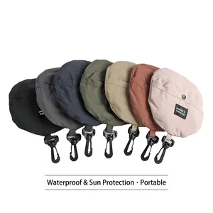 Cappelli da sole impermeabili in sacchetti pieghevoli con ganci in sette colori