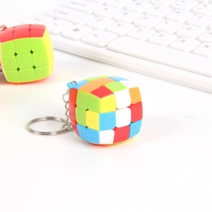 Macro detail of 3x3 mini cube keychains with vibrant colors and silver metal rings