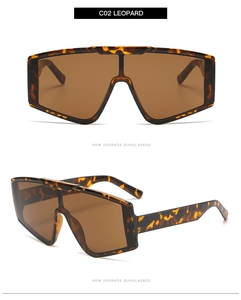 Detail view of leopard print frames and brown lenses on fashion wrap-around sunglasses