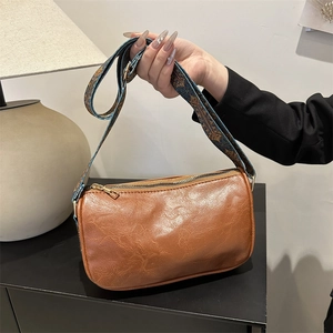Brown soft leather hobo bag with ethnic style blue patterned shoulder strap for women