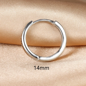 Detailed view of 14mm silver hoop earring on satin fabric showing the hinge mechanism