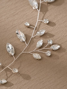 Macro shot of silver metal wire bridal hairband featuring detailed marquise rhinestones