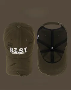Detail of olive green distressed baseball cap showing B.E.S.T embroidery and ripped edges
