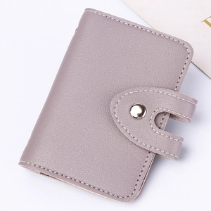 Detail of light purple PU leather card holder showing fine texture and white stitching