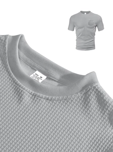 Detailed view of grey waffle fabric texture and crew neck collar on men's t-shirt
