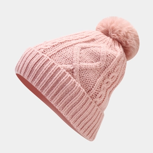 Close-up of pink cable knit beanie with faux fur pom pom and ribbed cuff detail