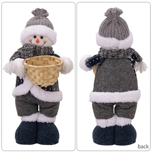 Front and back detail of a plush Christmas snowman doll holding a bamboo basket