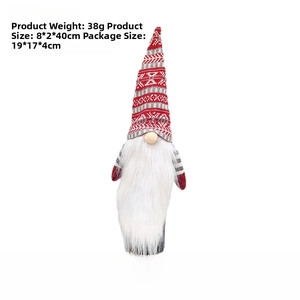 Detail of a Christmas gnome bottle cover with red knit hat and long white faux fur beard