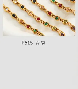 Macro shot of gold-plated chains with colorful faux gemstone inlay in a vintage design