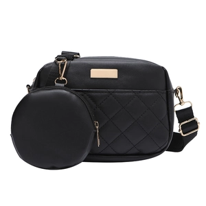 Quilted black crossbody bag with round coin purse and adjustable strap in a set