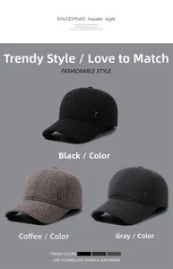 Close-up of winter baseball caps for men in black, brown and grey with wool-like fabric