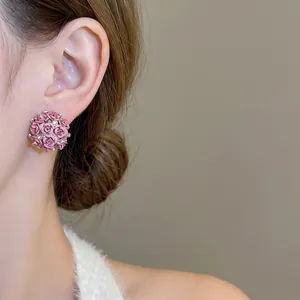 Elegant 3D pink rose ball earrings with diamond accents and gold outlines for women