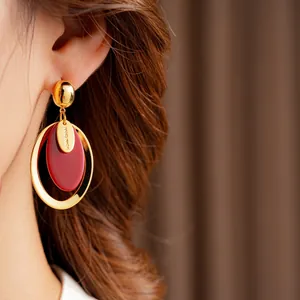 Exquisite gold-plated oval resin drop earrings with a handmade charm for women