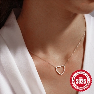 Classic S925 sterling silver minimalist heart pendant necklace on female model