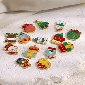 Christmas enamel pendants set with Santa, reindeer, and tree designs on 18K gold base