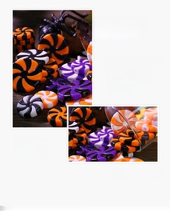 Macro detail of swirl patterned candy beads for Halloween and festive DIY decorations