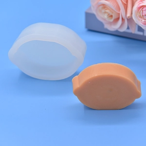Pear and lemon shaped silicone DIY mold set with an orange sample for soap making