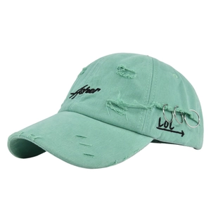 Detail of mint green distressed cotton baseball cap with Asher embroidery and metal rings