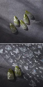 Macro detail of laser butterfly nail stickers with aurora moon and star glitter patterns