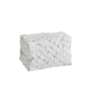 Quilted floral makeup bag with red cherry pattern and secure zipper closure for travel